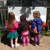 3 girls doing art outside